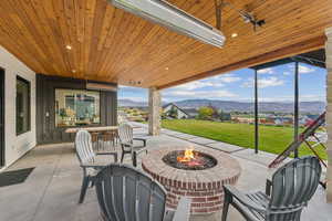 View of patio / terrace featuring a mountain view and an outdoor fire pit