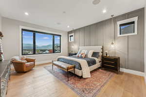 Bedroom featuring a mountain view and light wood-type flooring