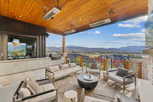 View of patio featuring a mountain view and outdoor lounge area