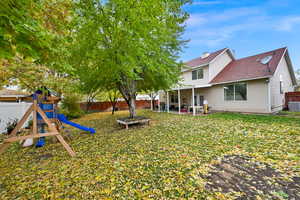 View of yard with a playground and a patio