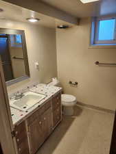 Bathroom with toilet and vanity