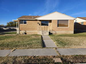 View of front of property with a front yard