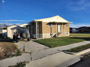 View of front of property with a front yard