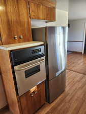 Kitchen featuring light hardwood / wood-style flooring and stainless steel appliances