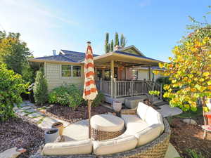 View of front of house with an outdoor hangout area