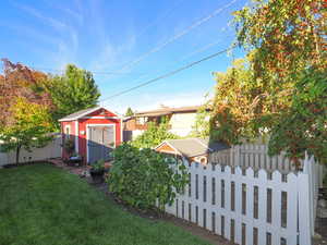 View of yard featuring a storage shed