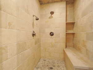 Bathroom featuring a tile shower