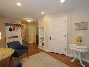 Sitting room with dark hardwood / wood-style floors