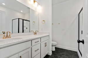 Primary bathroom with a double vanity and seperate tub and shower