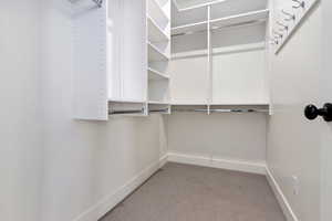 Spacious closet featuring adjustable shelving