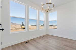 Dining area with a chandelier, and a mountain view