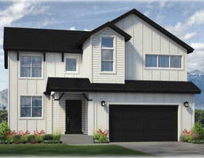 View of front of home featuring a garage