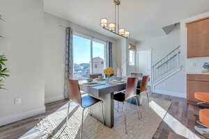 Dining room with dark hardwood / wood-style floors