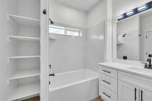 Master full bathroom with a soaking tub and vanity