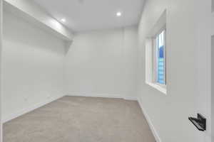 Bedroom 4 featuring recessed lighting, a closet, baseboards, and light carpet