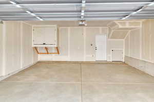 Garage extended with 20 ft doors,Wired for EV Charger 220 vlts. featuring a garage door opener