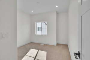 Bedroom 3 featuring recessed lighting, a closet, baseboards, and light carpet