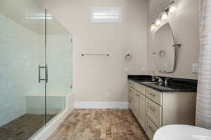 Bathroom with walk in shower and vanity