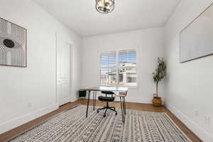 Home office featuring wood-type flooring