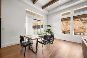 Dining room featuring hardwood / wood-style floors and beamed ceiling