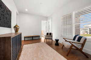 Living area with hardwood / wood-style floors