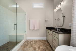 Bathroom with walk in shower and vanity