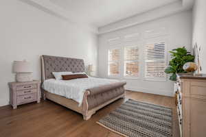 Bedroom featuring dark wood-type flooring