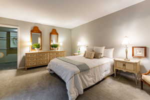 Bedroom with carpet flooring, a spacious closet, and a closet