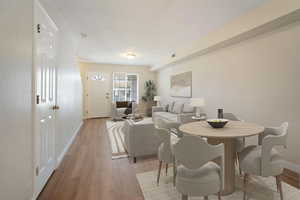 Dining area with light hardwood / wood-style floors