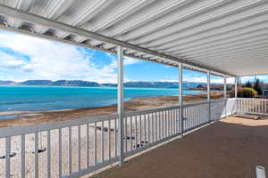 View from balcony featuring a water and mountain view