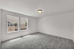 Unfurnished room featuring carpet floors