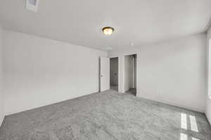 Unfurnished bedroom with carpet floors