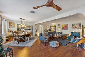 Living room with dark wood-type flooring