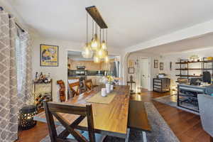 Dining space featuring dark wood-type flooring