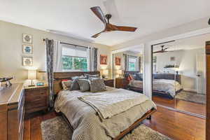 Bedroom featuring ceiling fan and dark hardwood / wood-style floors