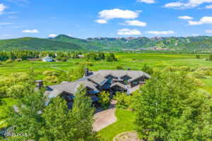 Birds eye view of property with a mountain view and a rural view