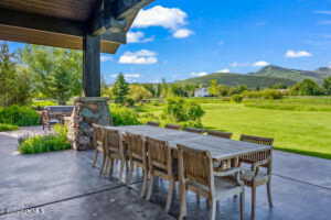 View of patio featuring a mountain view and an outdoor bar