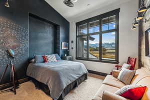 Bedroom featuring carpet flooring and lofted ceiling