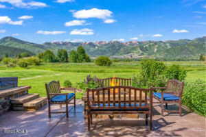 View of patio / terrace with a mountain view and a rural view