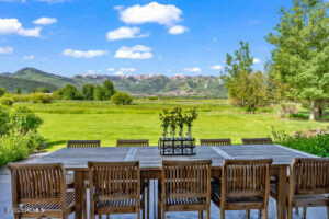 View of patio / terrace with a mountain view and a rural view