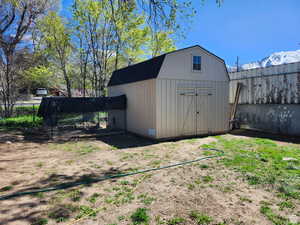 View of outbuilding featuring a mountain view