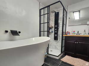 Bathroom with vanity and independent shower and bath