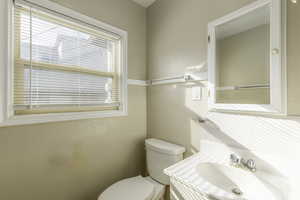 Bathroom featuring toilet and vanity