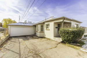 View of front facade featuring a garage