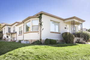 View of home's exterior with a lawn