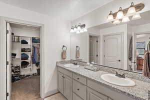 Bathroom featuring vanity and a textured ceiling