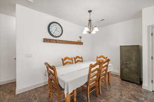 Dining room with an inviting chandelier