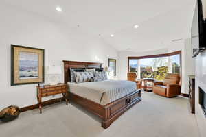 Primary Bedroom featuring 10-foot vaulted ceiling and views of downtown Salt Lake City