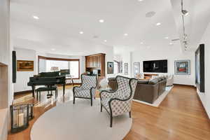 Living room featuring White Oak Wood Flooring with 10-foot ceilings