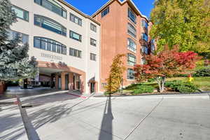 View of entrance to building and guest parking